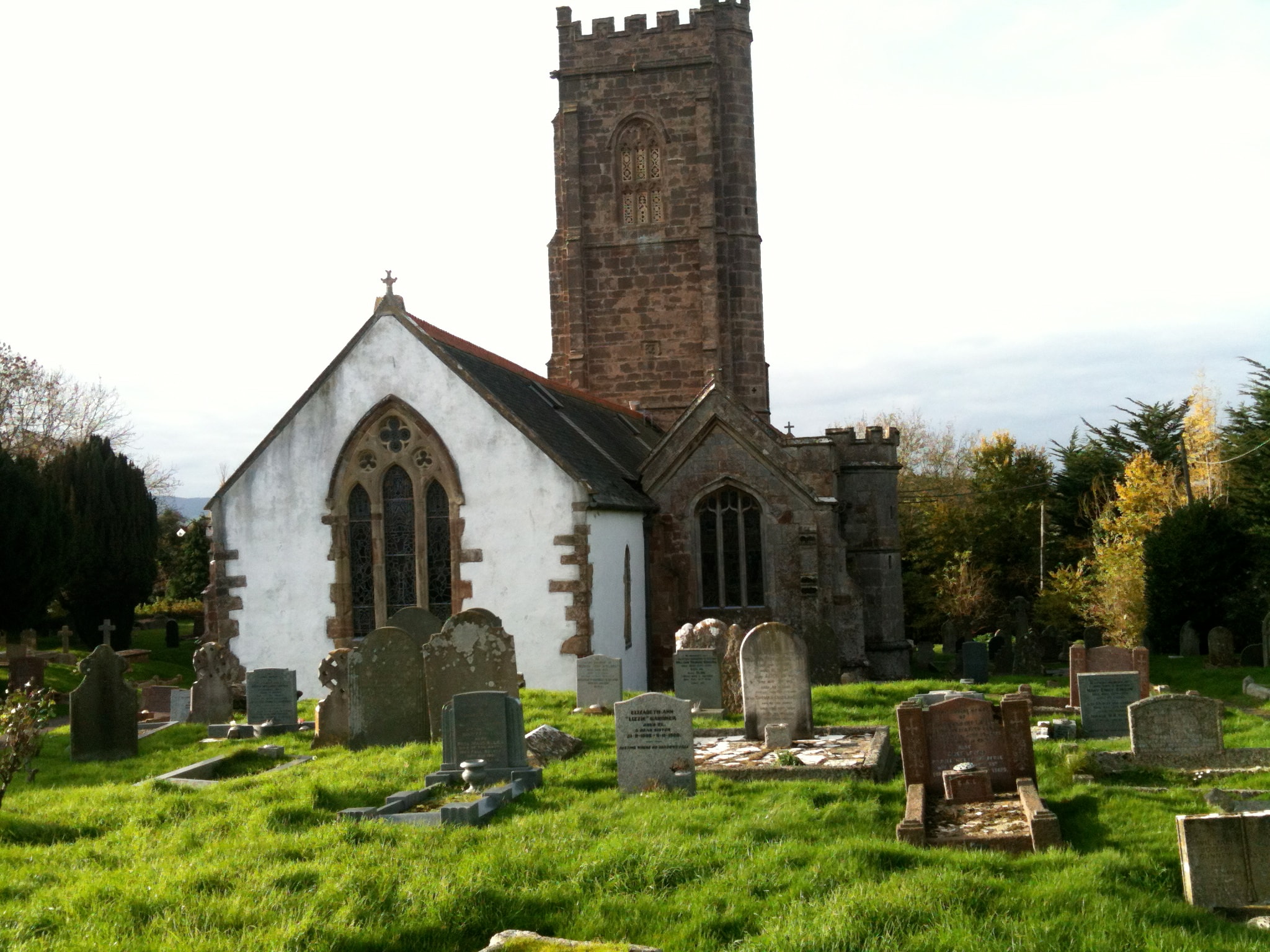Church with lime-washed nave and stone tower