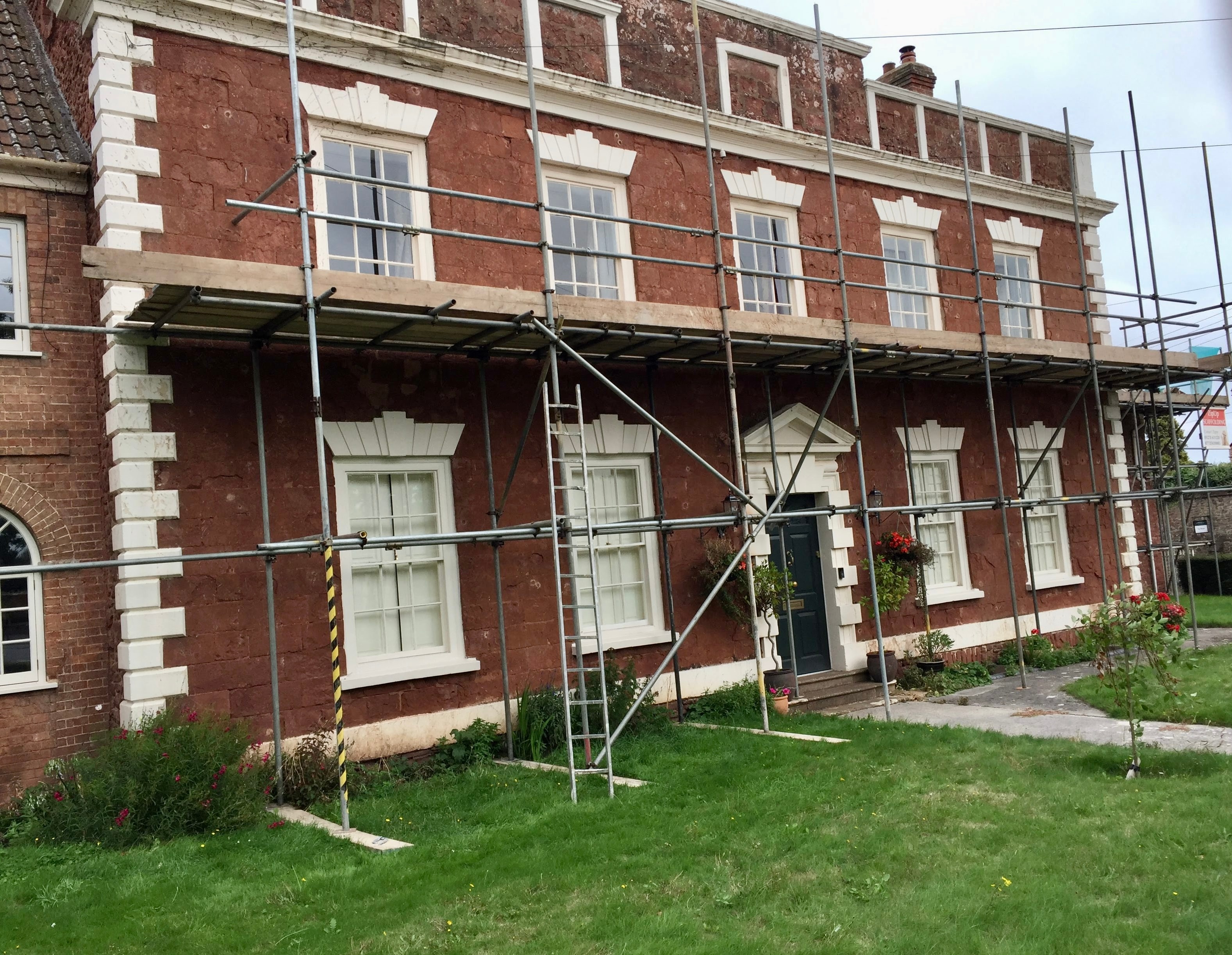 Historic red brick building under renovation — masonry restoration