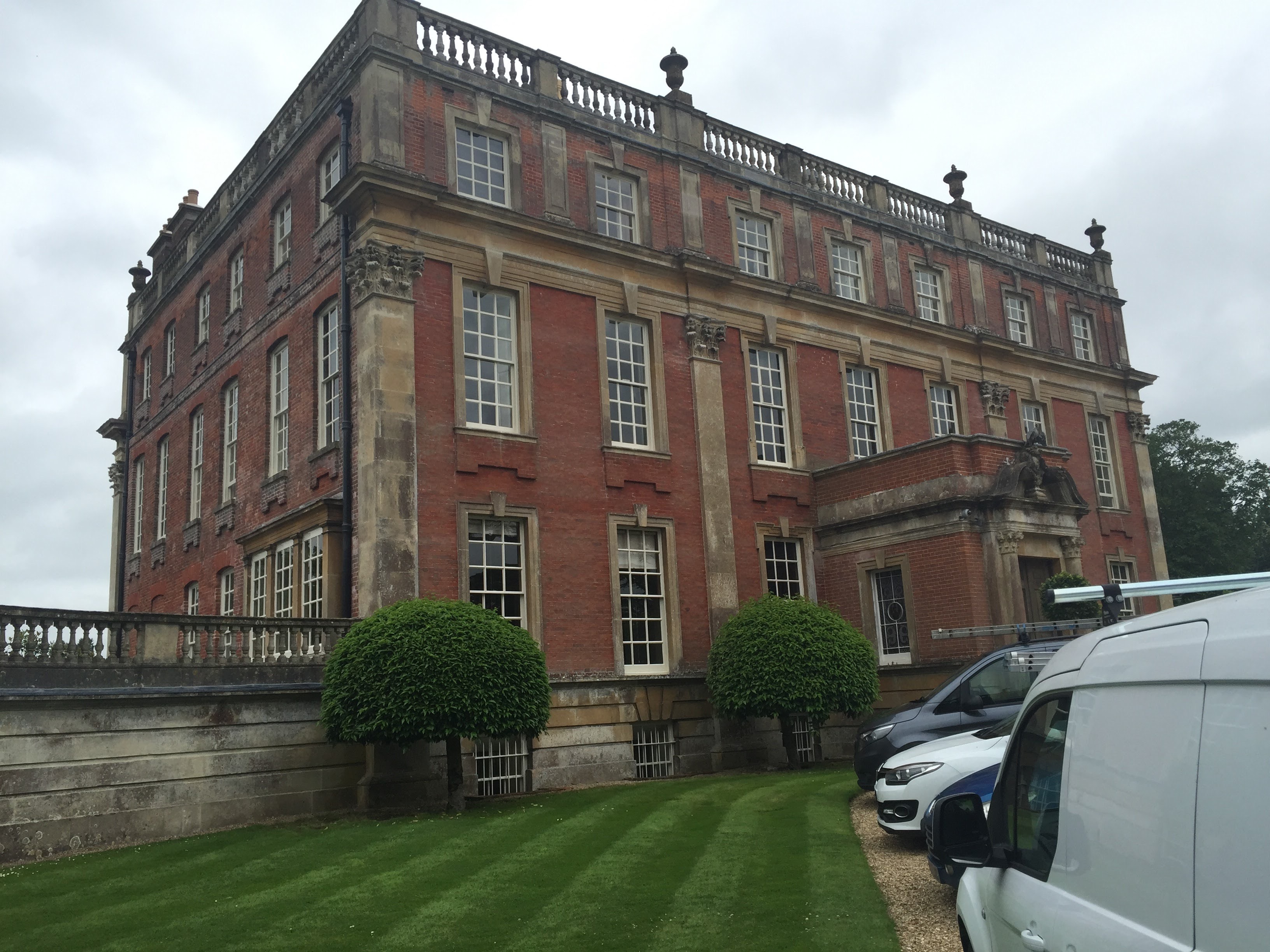 Historic red brick manor house exterior — period house restoration by St Blaise