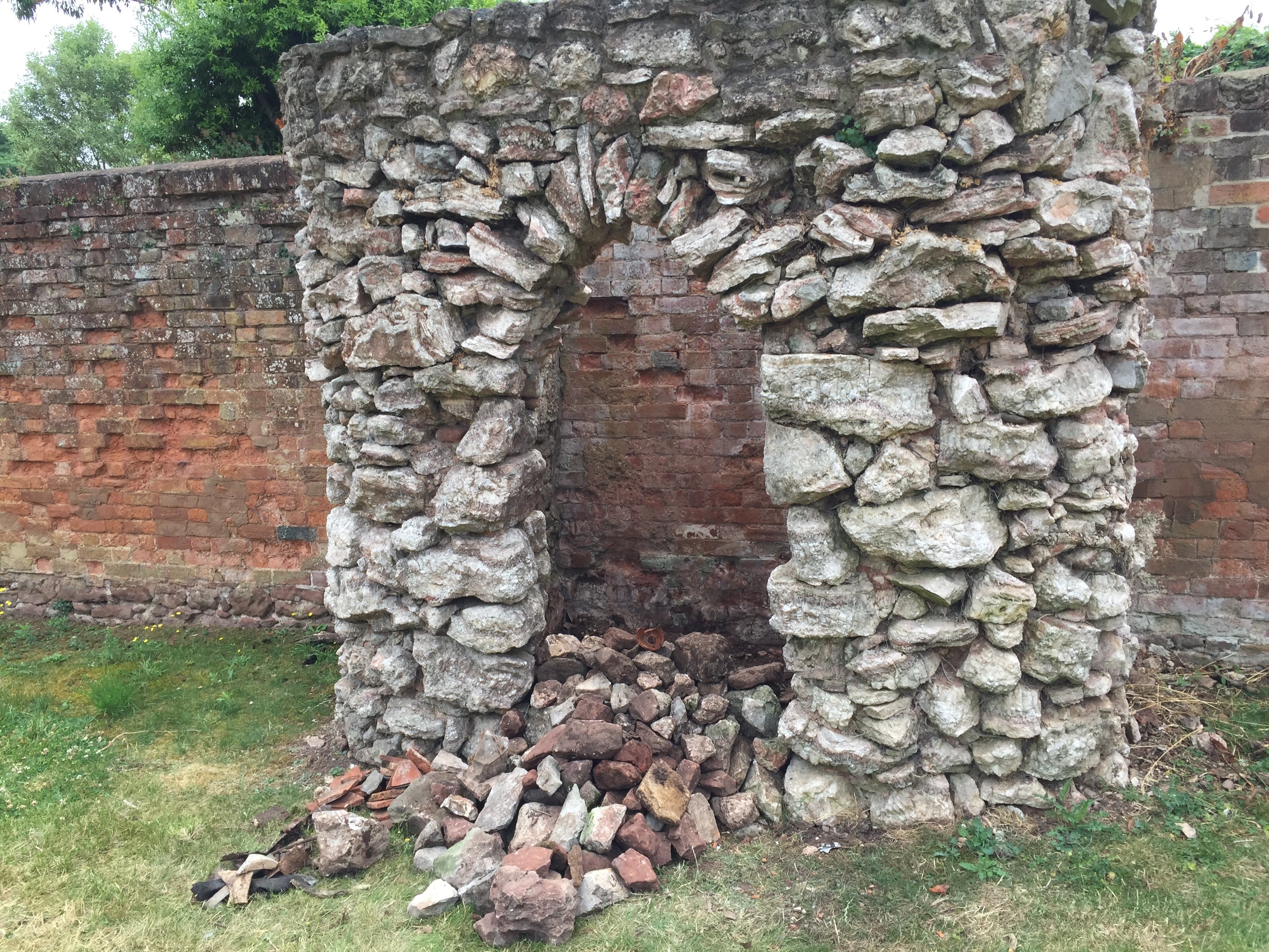 Aerial view of deteriorated stone and brick masonry